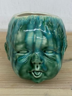 Green baby head planter